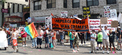 "IMPEACH BUSH FOR WAR CRIMES" World Can't Wait banner.