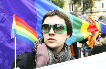 Russia Pride 2008: A woman waves gay pride flags
